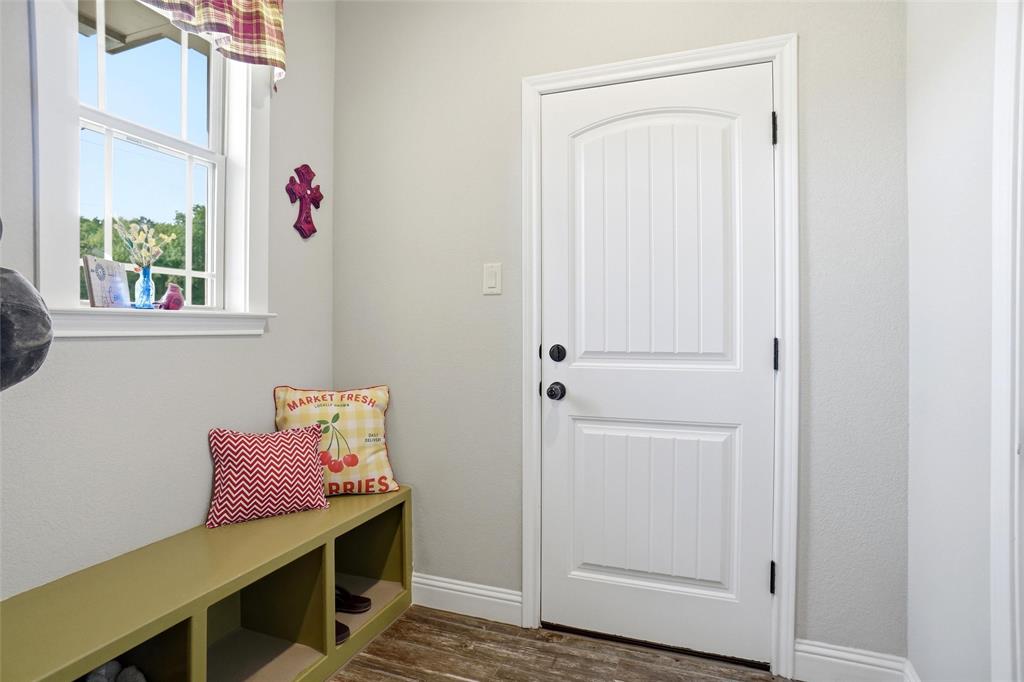 1024 Tex Lane Springtown, TX 76082 - Photo 27 of 40 a view of room with window and wooden floor