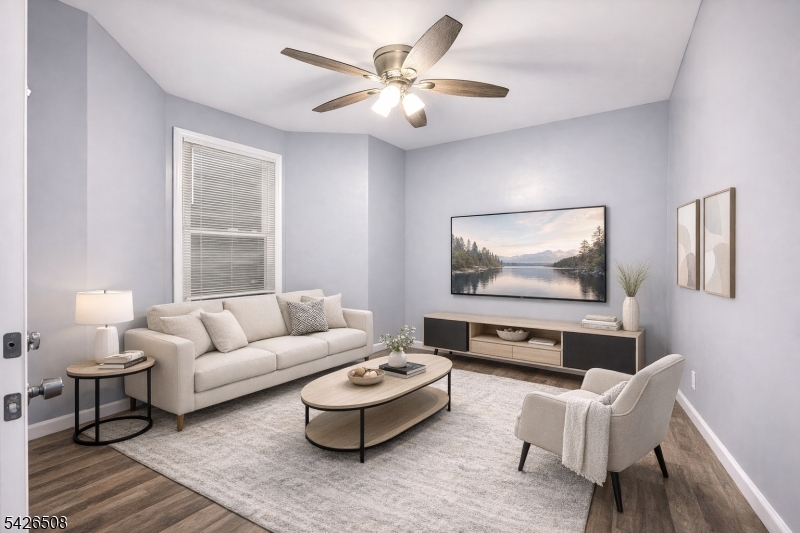 411 South 16th Street, Unit 1 Newark, NJ 07103 - Photo 1 of 39 a living room with furniture and a large window