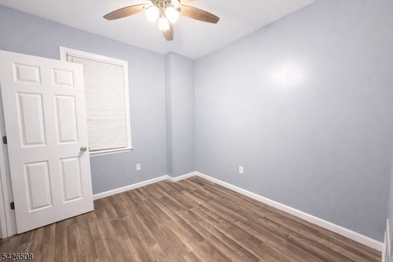 411 South 16th Street, Unit 1 Newark, NJ 07103 - Photo 12 of 39 wooden floor in an empty room with a window