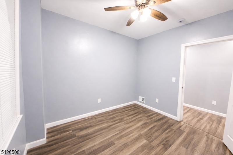 411 South 16th Street, Unit 1 Newark, NJ 07103 - Photo 15 of 39 wooden floor in an empty room
