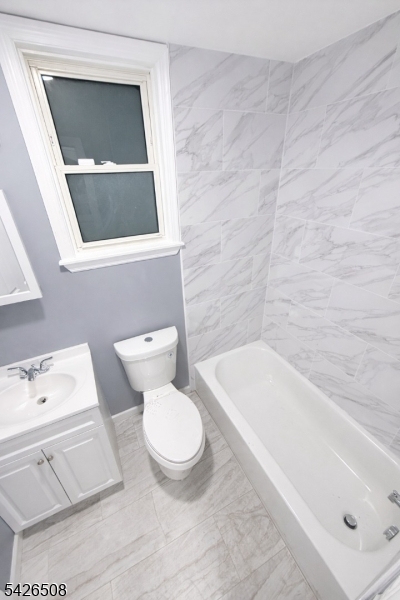 411 South 16th Street, Unit 1 Newark, NJ 07103 - Photo 19 of 39 a bathroom with a toilet a sink and bathtub
