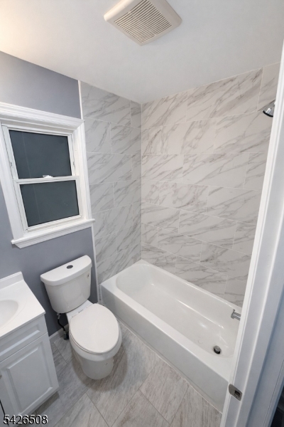 411 South 16th Street, Unit 1 Newark, NJ 07103 - Photo 21 of 39 a bathroom with a toilet a sink and bathtub