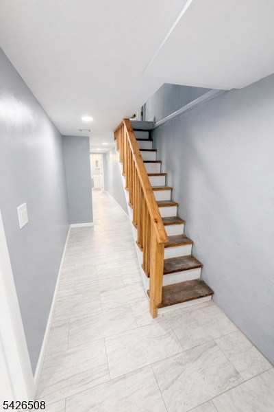 411 South 16th Street, Unit 1 Newark, NJ 07103 - Photo 22 of 39 a view of entryway and hall with wooden floor