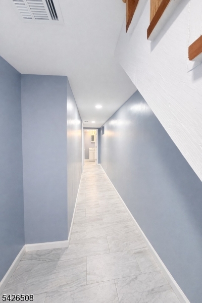 411 South 16th Street, Unit 1 Newark, NJ 07103 - Photo 25 of 39 a view of a hallway with wooden floor