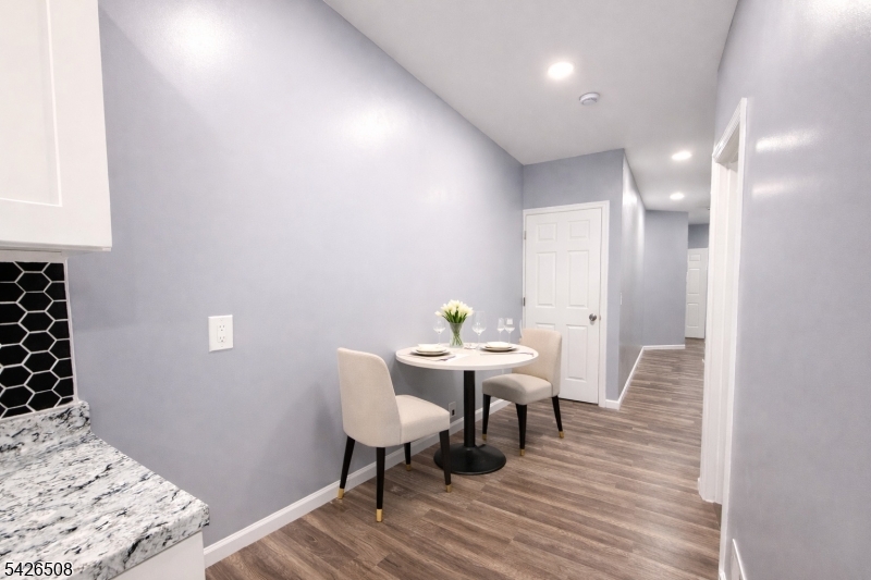 411 South 16th Street, Unit 1 Newark, NJ 07103 - Photo 7 of 39 a view of a dining room with furniture and wooden floor