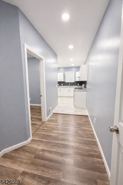411 South 16th Street, Unit 1 Newark, NJ 07103 - Photo 9 of 39 a view of a kitchen with wooden floor