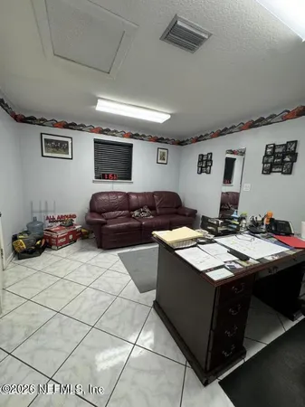 a kitchen with a sink a stove and cabinets