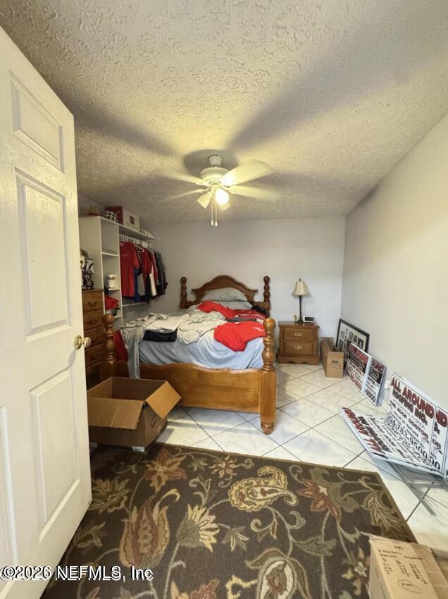 8540 West Beaver Street Jacksonville, FL 32220 - Photo 16 of 18 a bedroom with a bed and a dresser