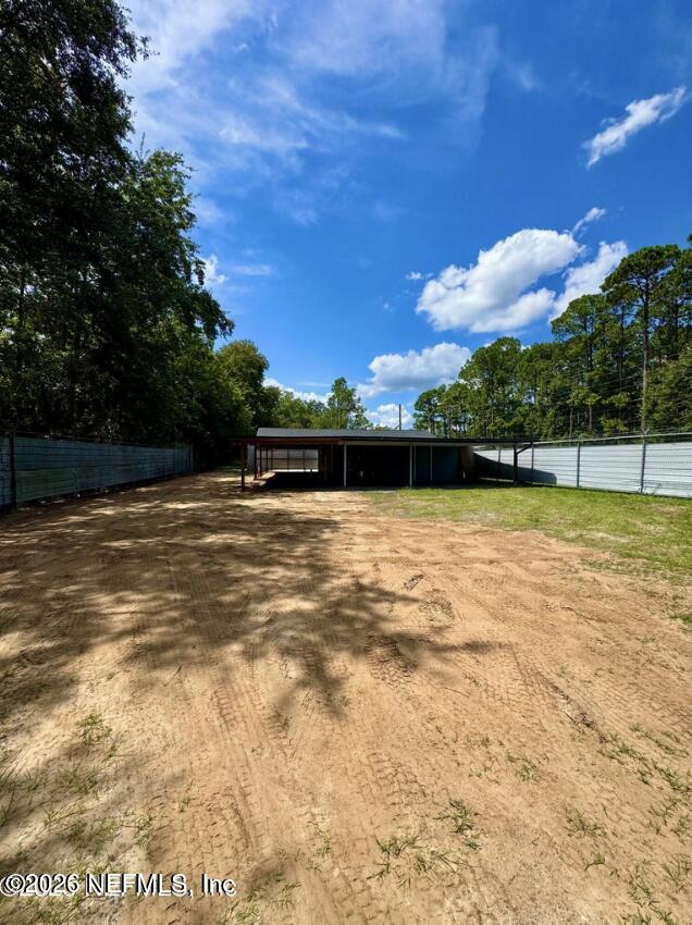8540 West Beaver Street Jacksonville, FL 32220 - Photo 6 of 18 a view of swimming pool with seating area and green space