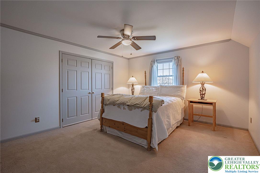 4542 Springfield Drive Coplay, PA 18037 - Photo 49 of 89 A comfortable bedroom featuring soft carpeting, a window for natural illumination, and practical closet space.