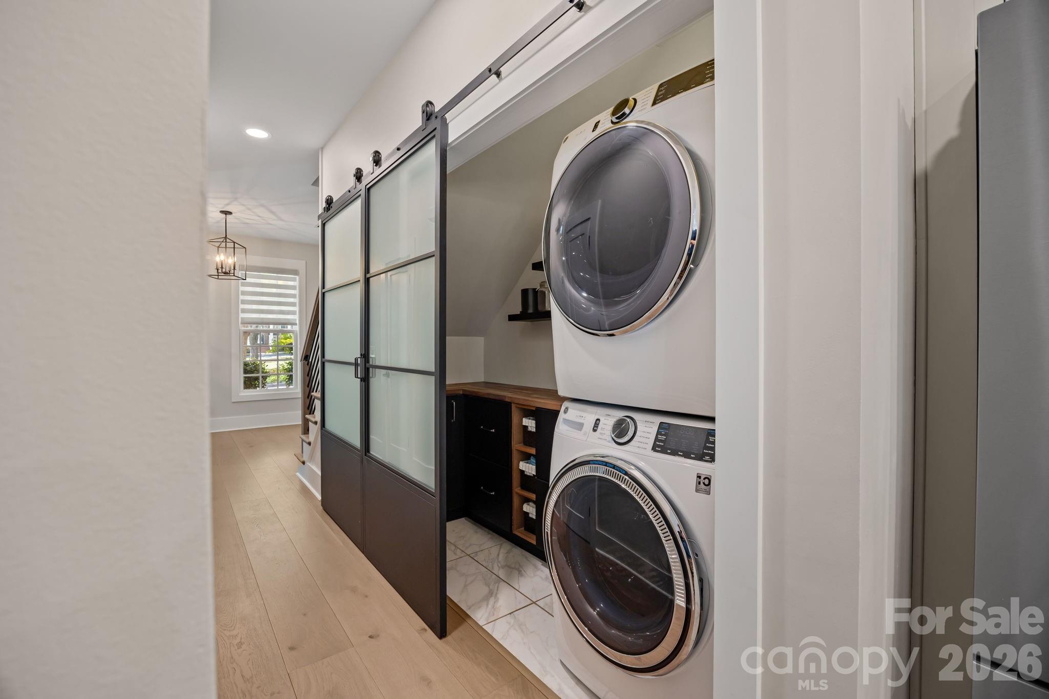 241 North Faulkner Way Davidson, NC 28036 - Photo 24 of 39 a view of a hallway with washer and dryer