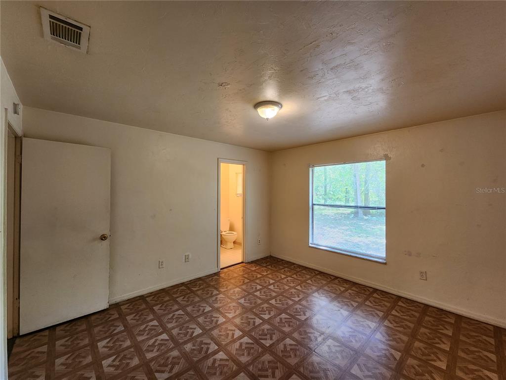 4021 Southwest 37 Street, Unit C Gainesville, FL 32608 - Photo 20 of 25 an empty room with windows