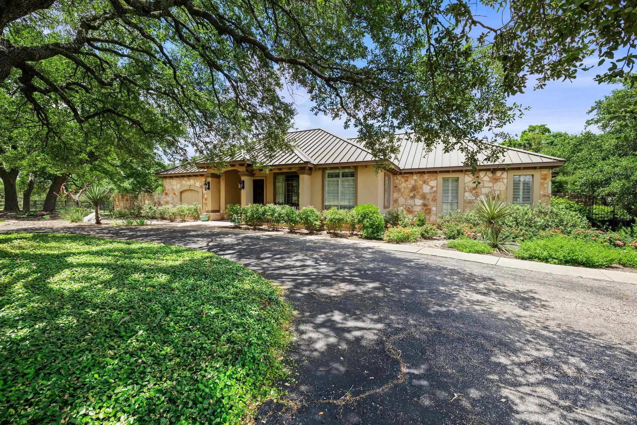 101 Rio Gabriel Drive Liberty Hill, TX 78642 - Photo 1 of 1 a front view of a house with garden