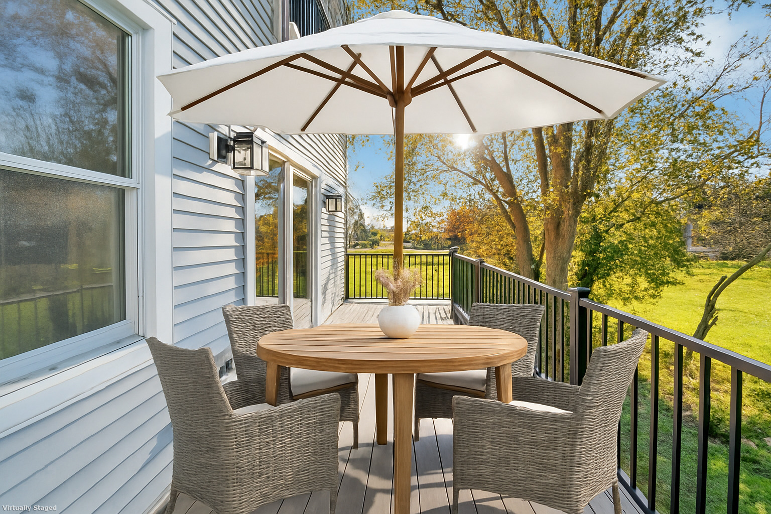 212 Milford Point Road Milford, CT 06460 - Photo 11 of 38 a view of a patio with a table and chairs under an umbrella