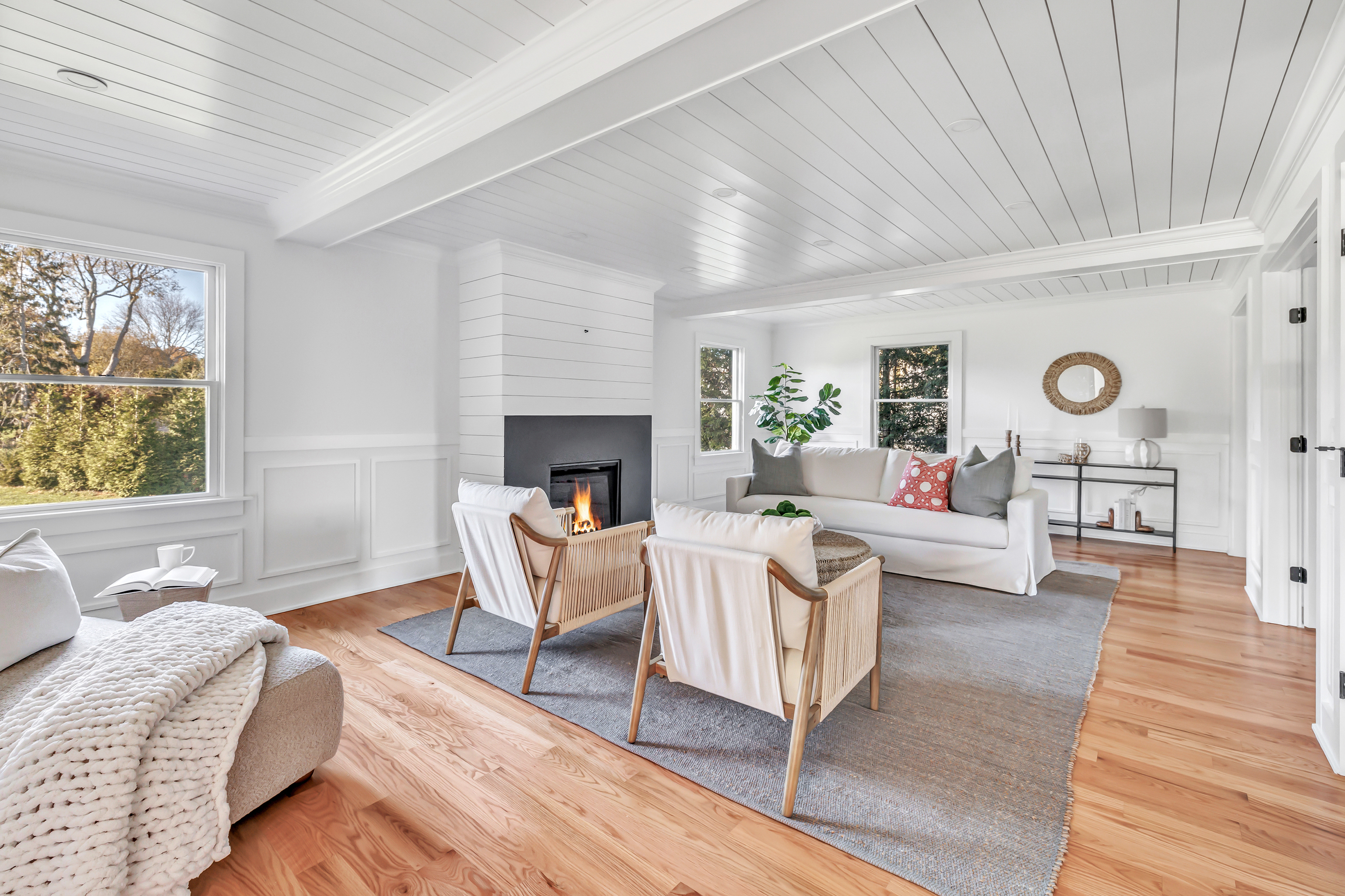 212 Milford Point Road Milford, CT 06460 - Photo 13 of 38 a living room with furniture and a fireplace