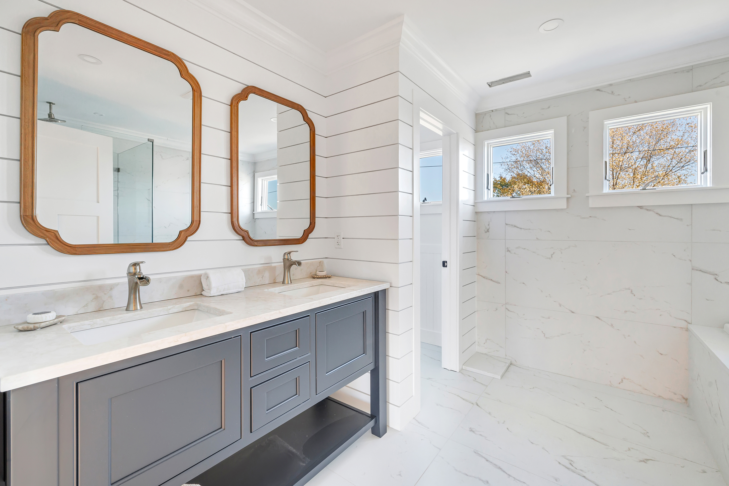 212 Milford Point Road Milford, CT 06460 - Photo 19 of 38 a bathroom with a double vanity sink mirror and a
