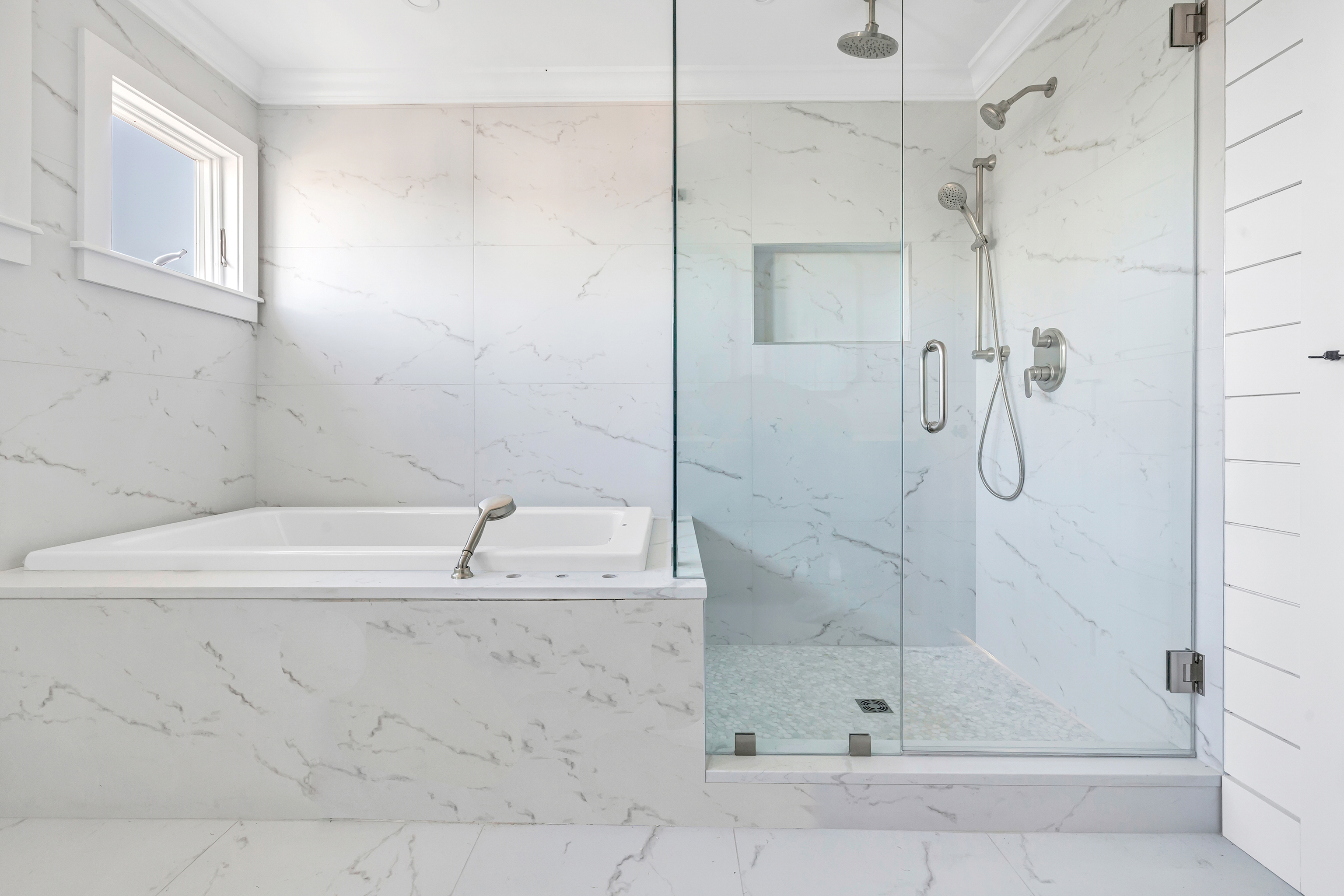 212 Milford Point Road Milford, CT 06460 - Photo 20 of 38 a bathroom with a bathtub and a shower