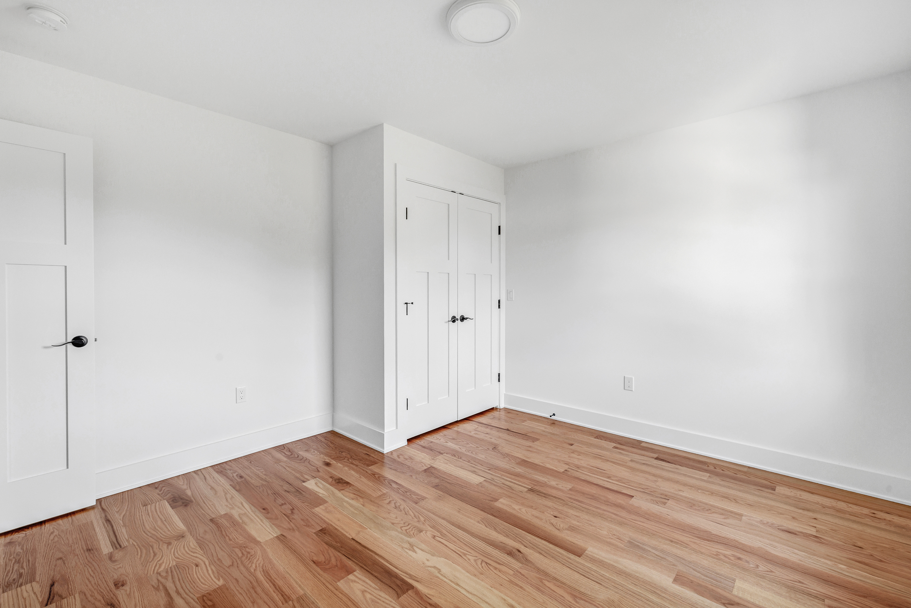212 Milford Point Road Milford, CT 06460 - Photo 25 of 38 a view of empty room with wooden floor