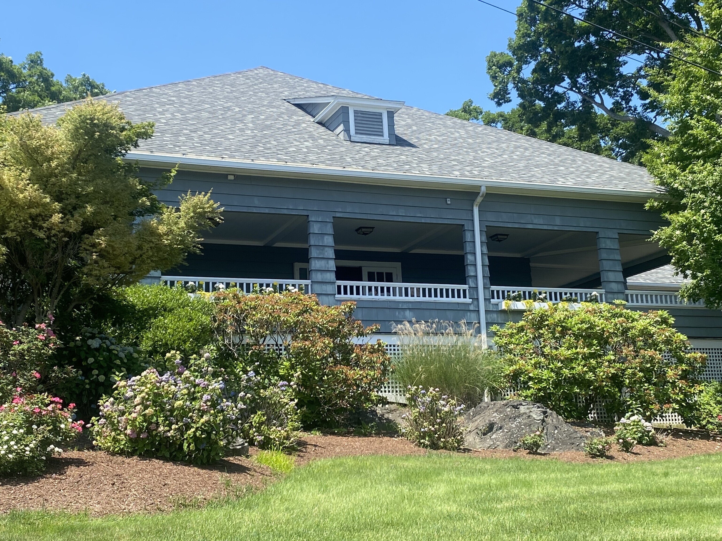 212 Milford Point Road Milford, CT 06460 - Photo 35 of 38 a front view of a house with a garden