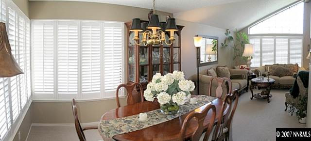 160 Edgewater Parkway Reno, NV 89519 - Photo 3 of 9 a living room filled with furniture and a chandelier