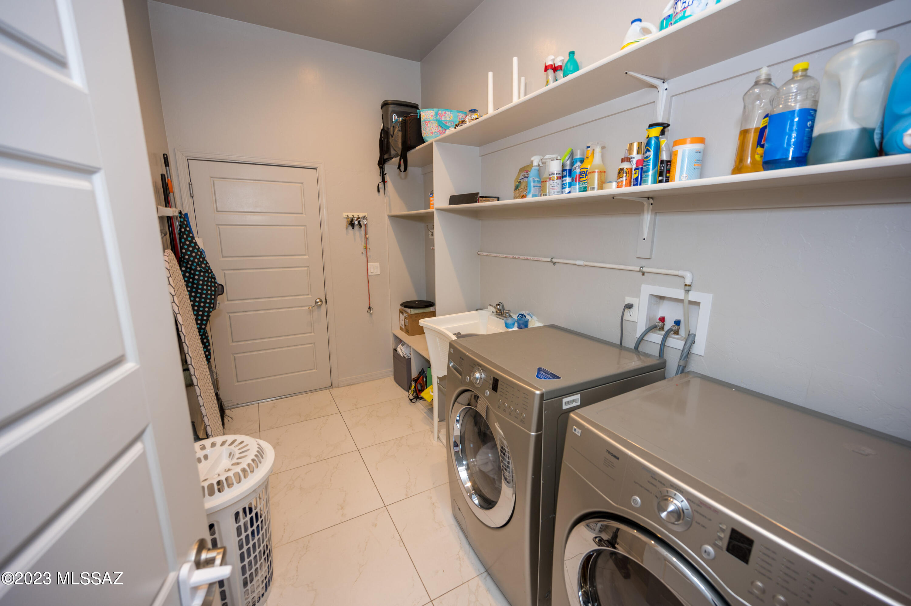 384 Via Estrella Vista Rio Rico, AZ 85648 - Photo 32 of 32 a utility room with dryer and washer