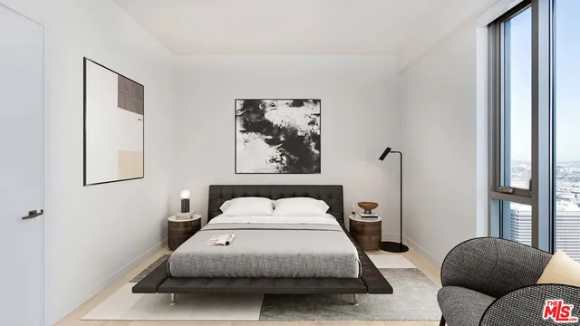 a bedroom with a bed and window