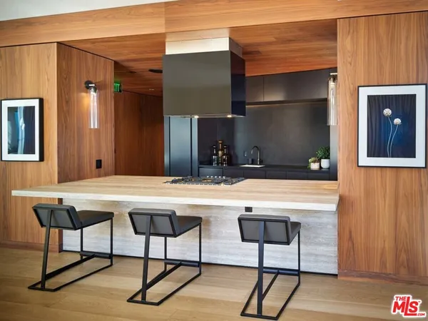 a kitchen with a table and chairs