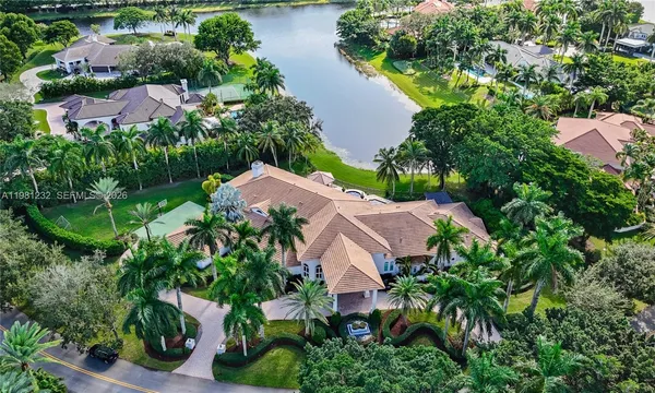 an aerial view of house with swimming pool outdoor seating and yard