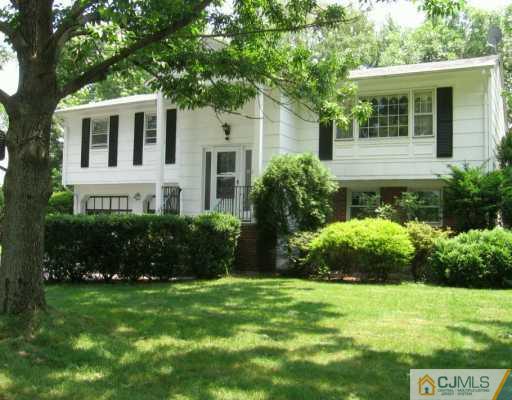 5 Eagle Road Edison, NJ 08820 - Photo 1 of 6 a front view of a house with a yard