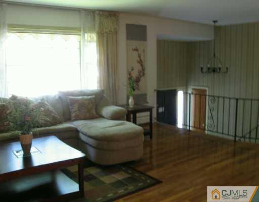 5 Eagle Road Edison, NJ 08820 - Photo 2 of 6 a living room with furniture and a window