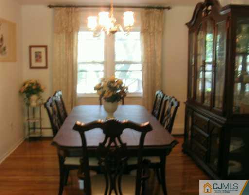 5 Eagle Road Edison, NJ 08820 - Photo 3 of 6 a view of a dining room with furniture and a chandelier