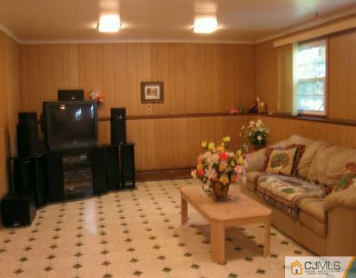 5 Eagle Road Edison, NJ 08820 - Photo 5 of 6 a living room with a couch