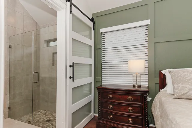 a bathroom with a bathtub and shower