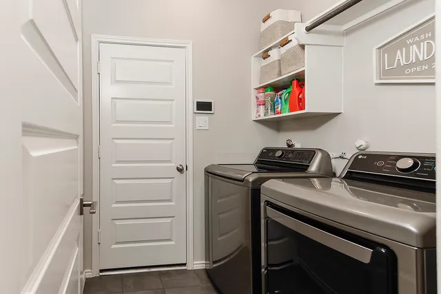 a utility room with washer and dryer