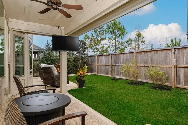 a living room with patio furniture