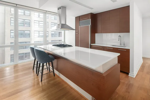 a kitchen with a stove a sink and a refrigerator
