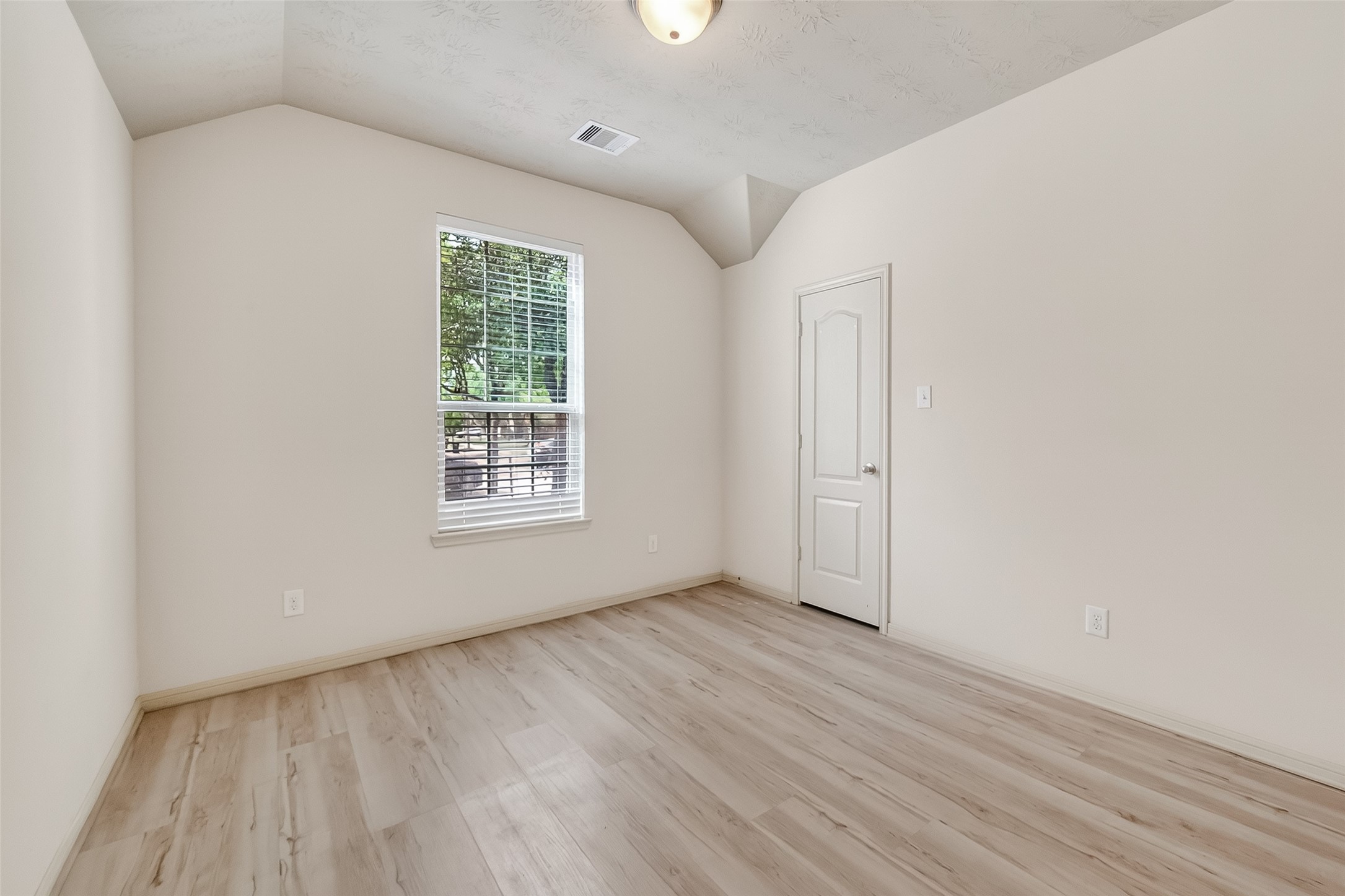 13415 Star Creek Lane Rosharon, TX 77583 - Photo 28 of 46 a view of an empty room with wooden floor and a window