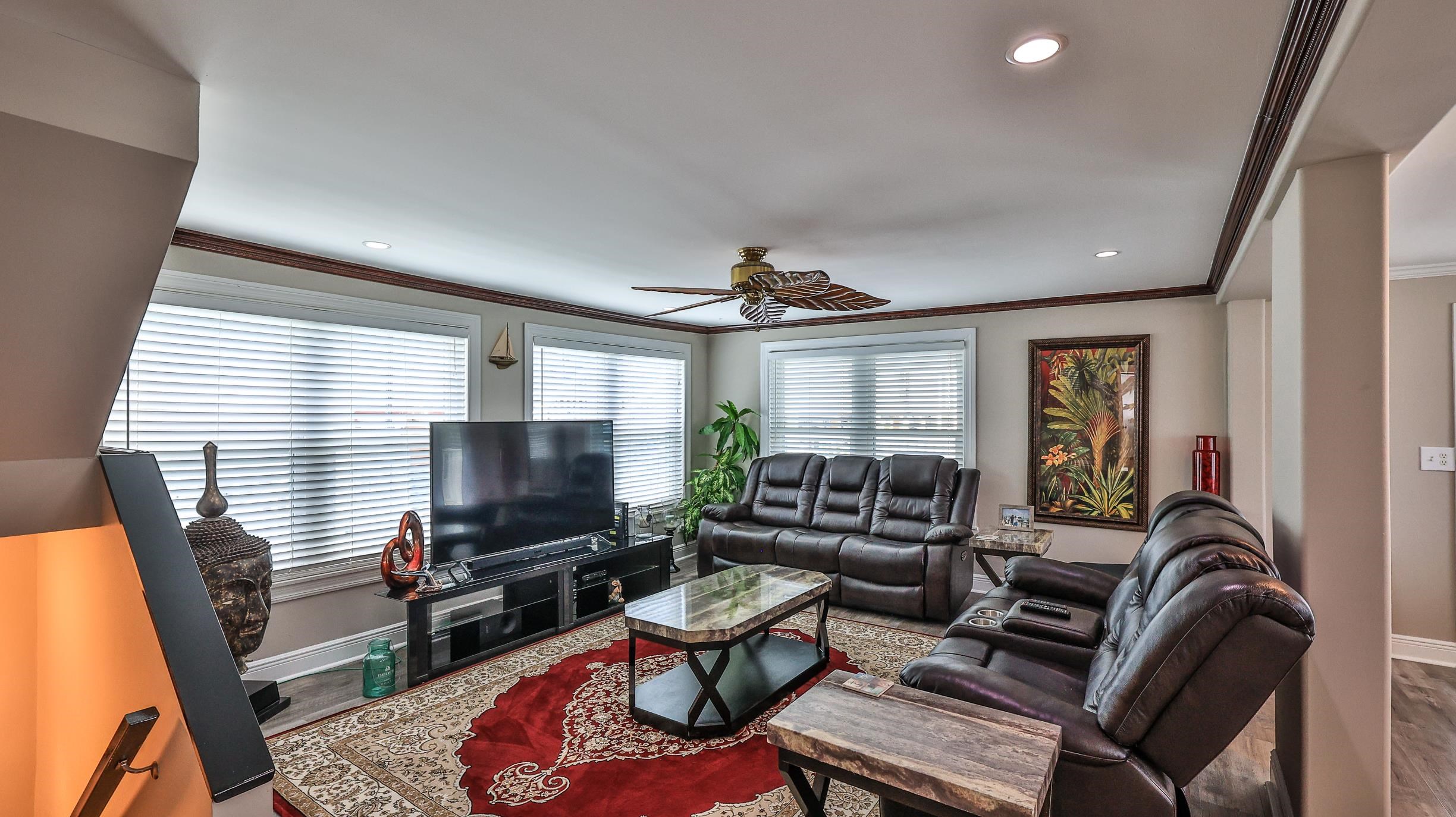 49 Zamora Street St. Augustine, FL 32084 - Photo 13 of 64 a living room with furniture a flat screen tv and a window