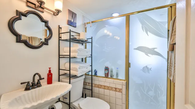 a balcony with furniture and a potted plant