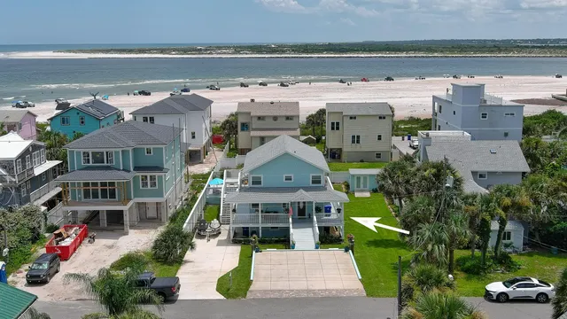 an aerial view of a house with a garden and plants
