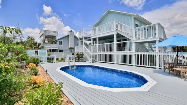 a view of a balcony with wooden fence