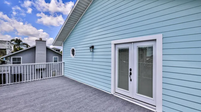 a bedroom with a bed couch and window