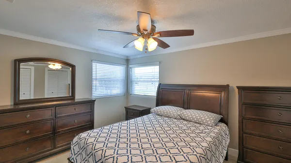 a bedroom with a bed and a television