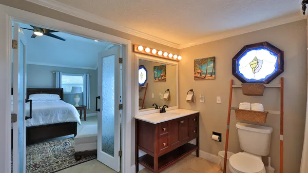 a kitchen with sink and refrigerator