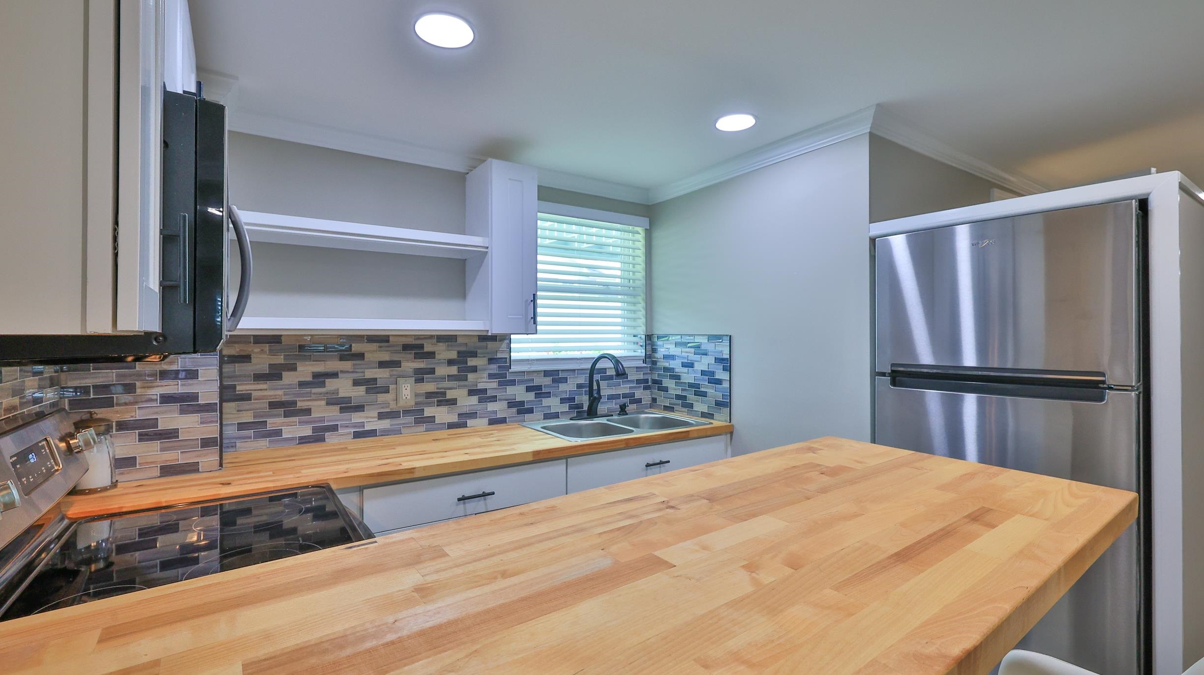 49 Zamora Street St. Augustine, FL 32084 - Photo 46 of 64 a kitchen with sink and refrigerator