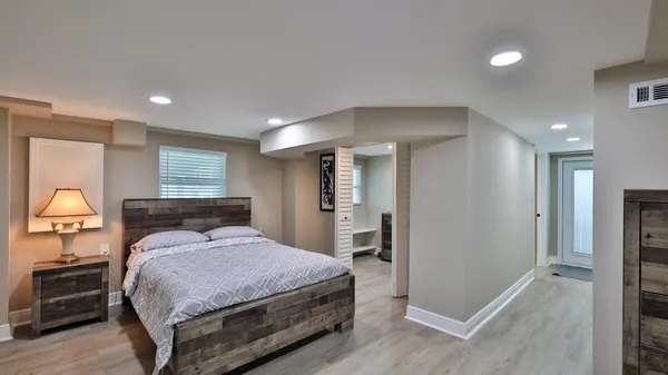 a view of a storage and utility room with washer and dryer