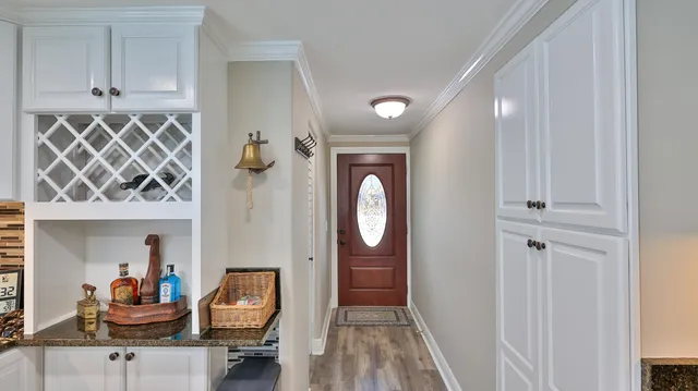 a kitchen with stainless steel appliances granite countertop sink stove top oven and cabinets