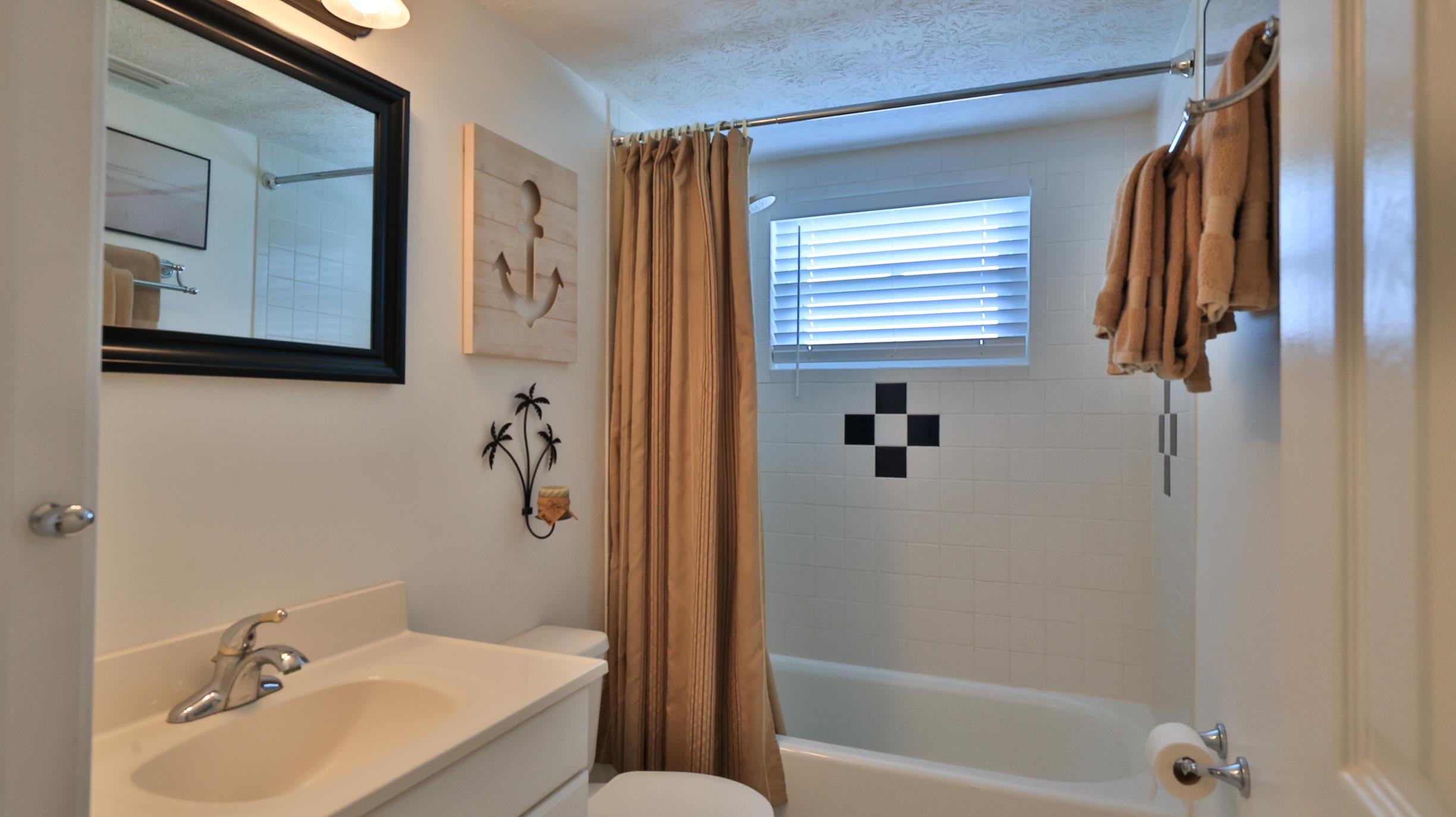 49 Zamora Street St. Augustine, FL 32084 - Photo 51 of 64 a bathroom with a sink toilet and shower