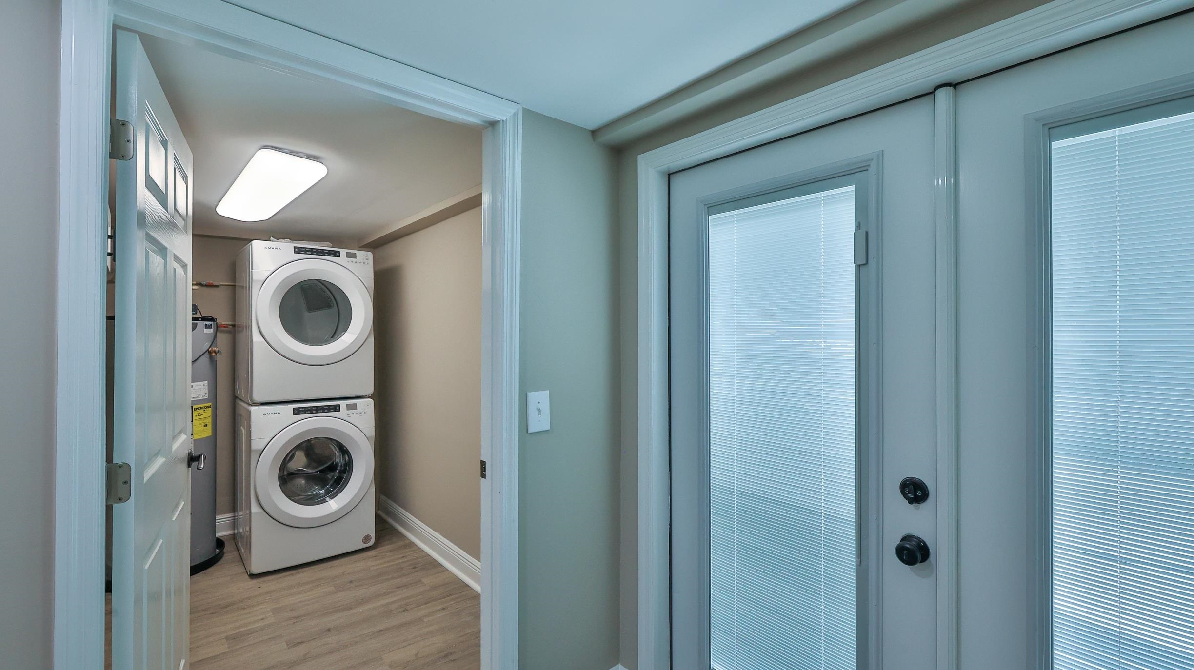 49 Zamora Street St. Augustine, FL 32084 - Photo 54 of 64 a view of a storage and utility room with washer and dryer