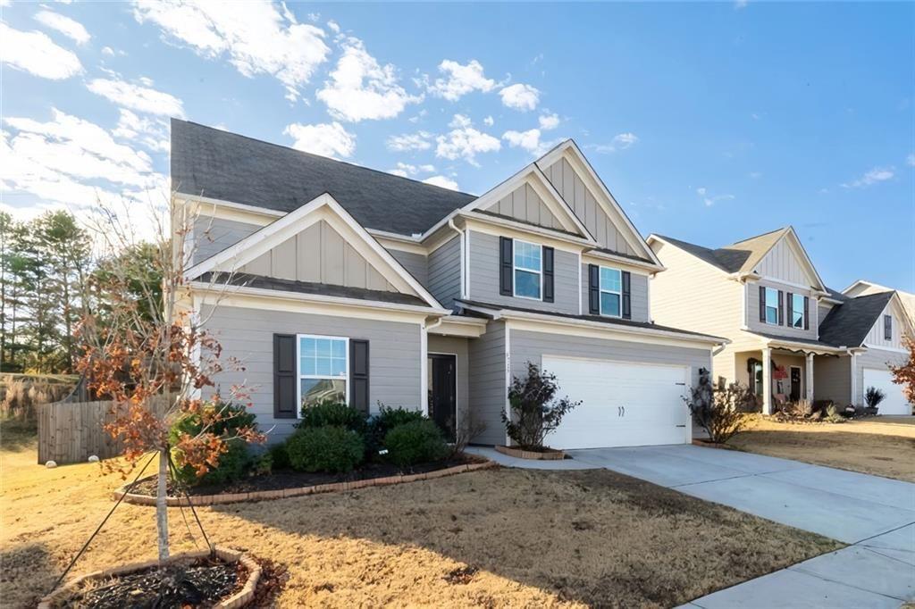 735 Walnut Creek Circle Pendergrass, GA 30567 - Photo 2 of 29 a front view of a house with garden